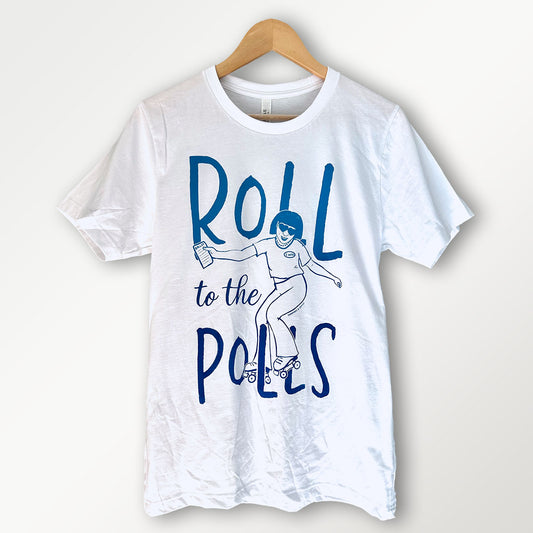 white t-shirt with roll to the polls text and a graphic of a woman skating in blue