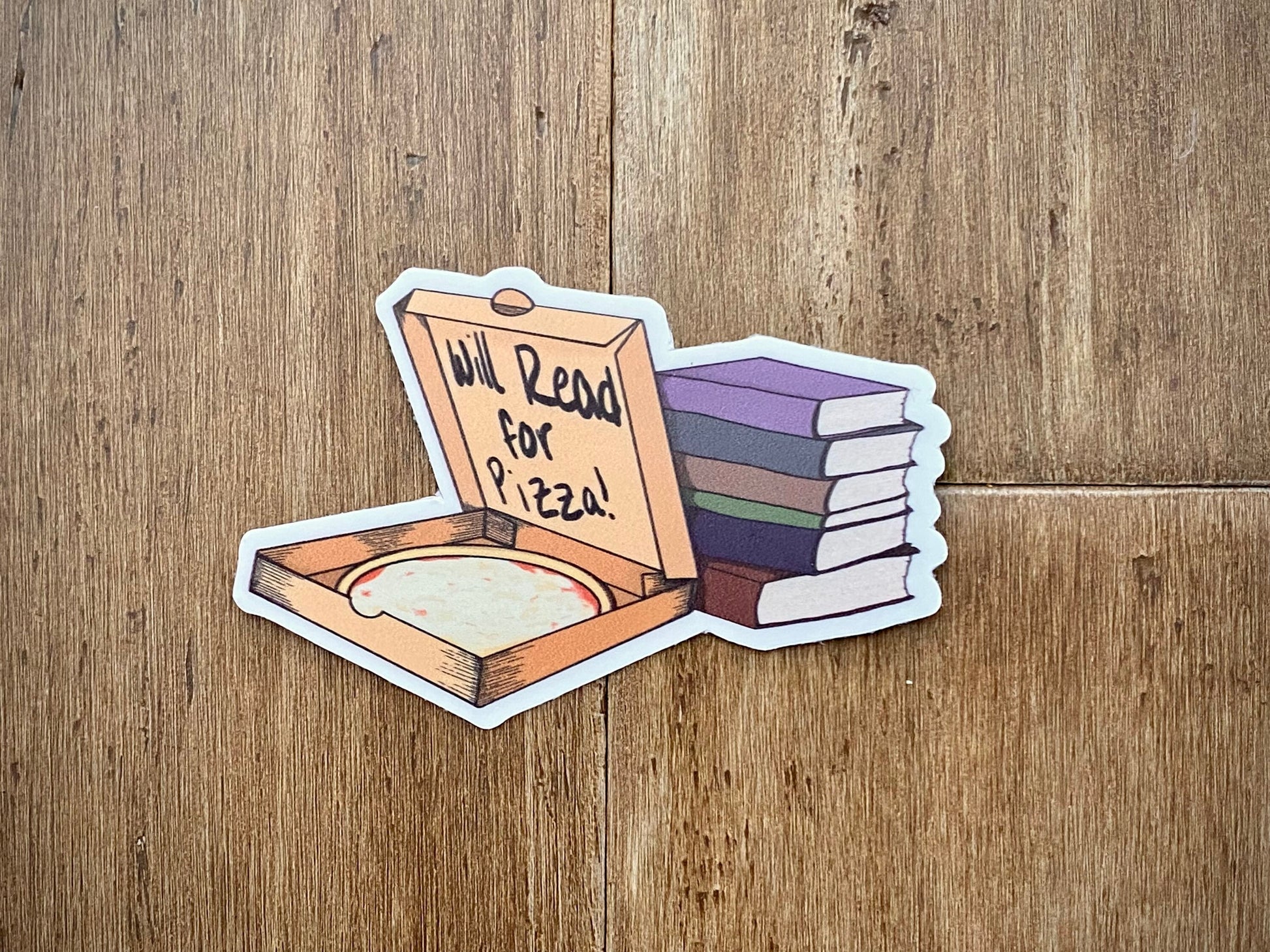 sticker showing a pizza box with a stack of books with text "will read for pizza" on a wood background